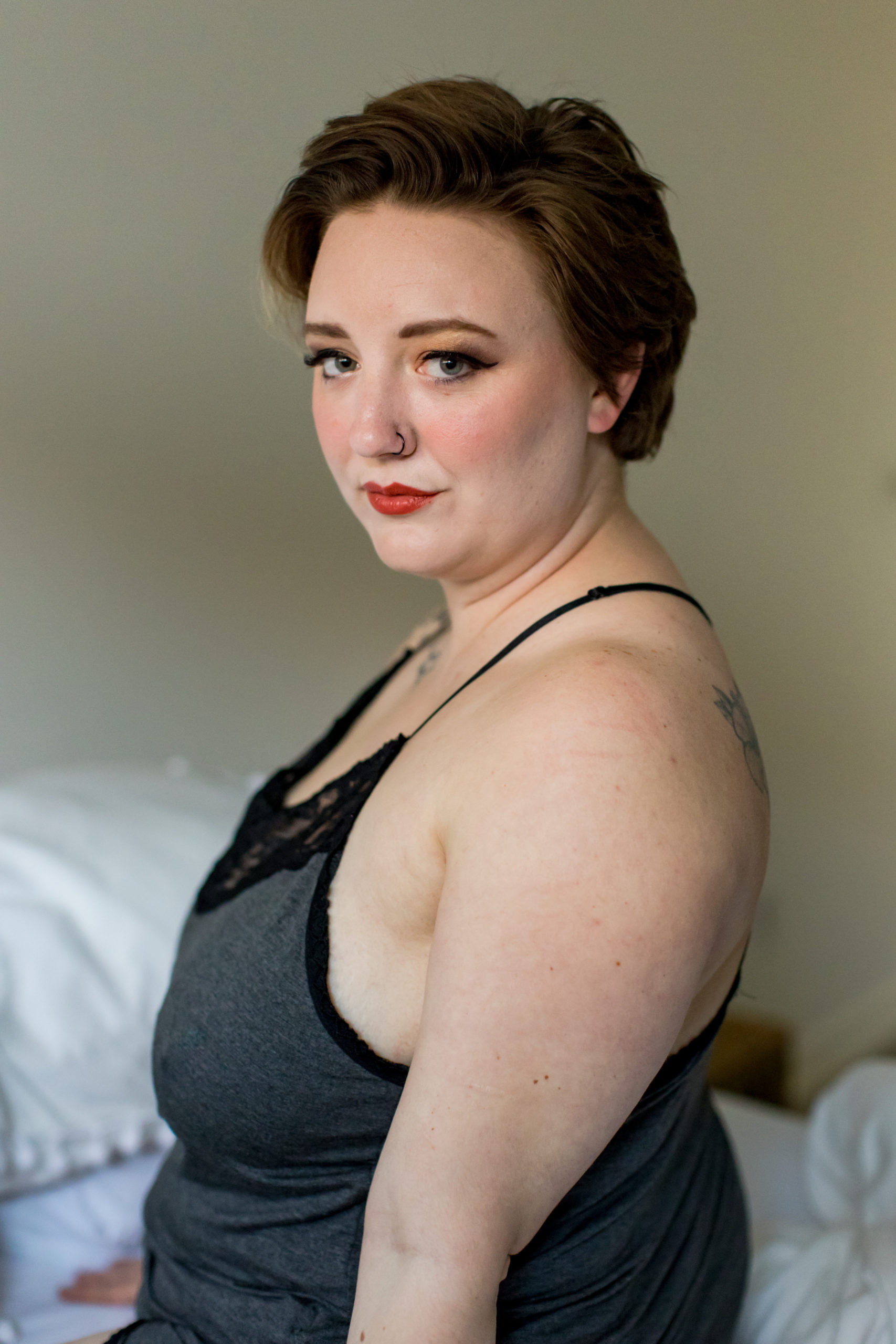 Woman poses for the camera during her self-empowerment boudoir session