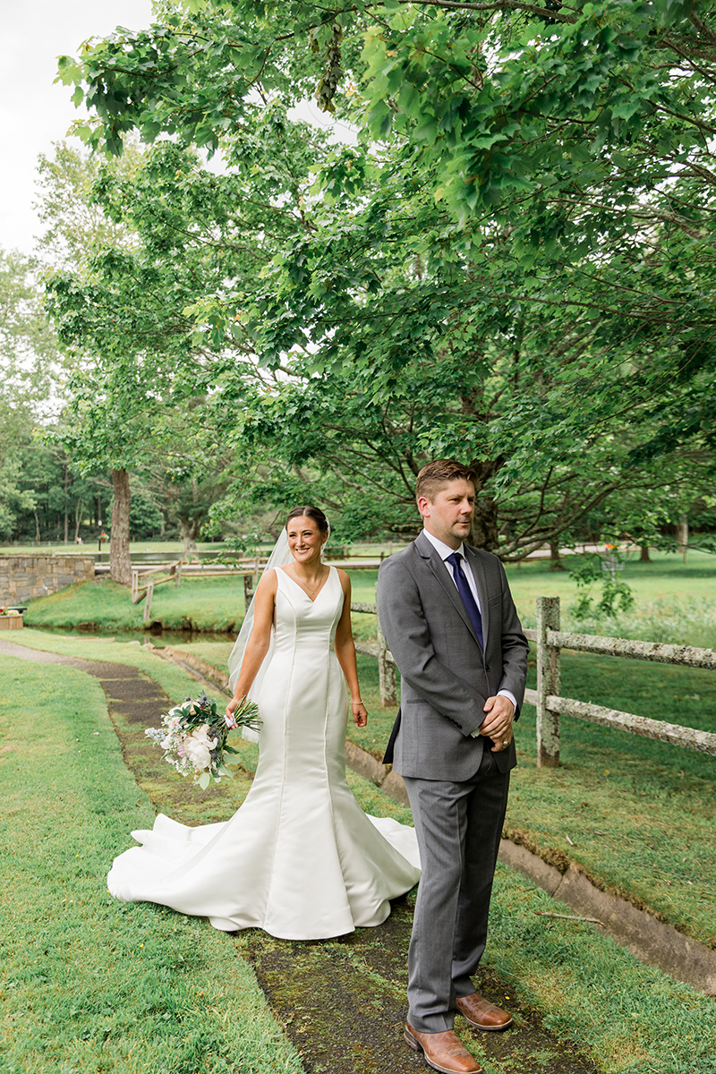 Groom waits for bride during first look on their wedding day in Blowing Rock, NC